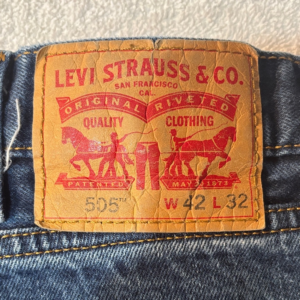 Levi's 505 Relaxed Fit Jeans in Blue with Brown Patch